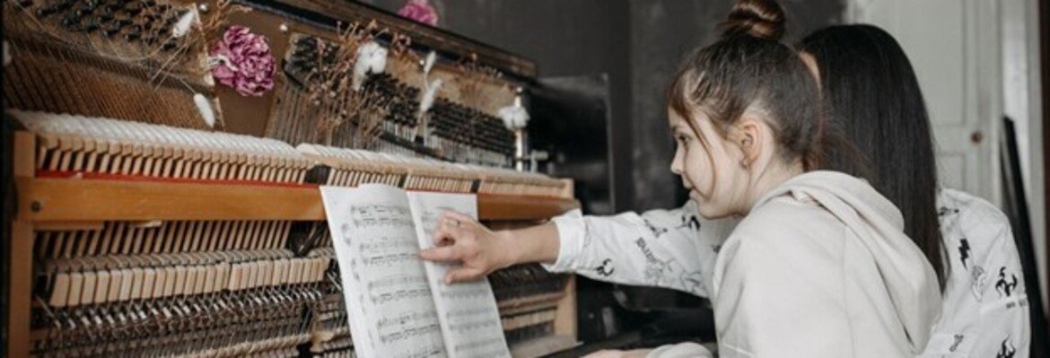 piano teacher teaching the piano